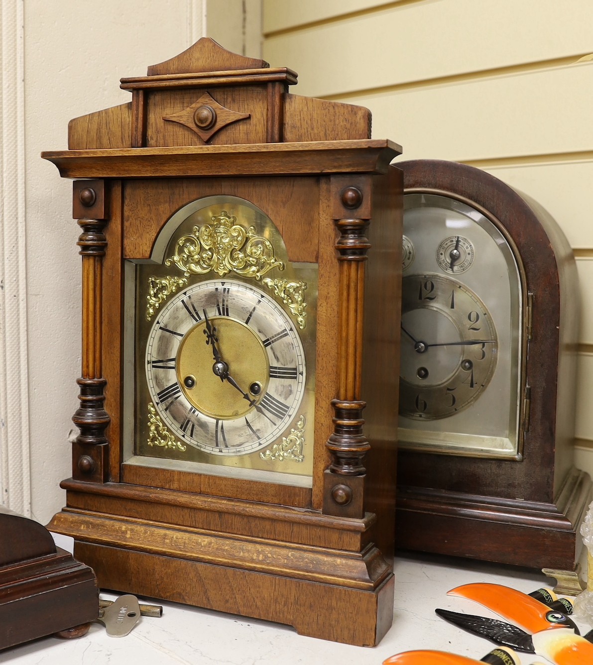 Two domed mantel clocks, a Connecticut shelf clock and a Black Forest mantel clock